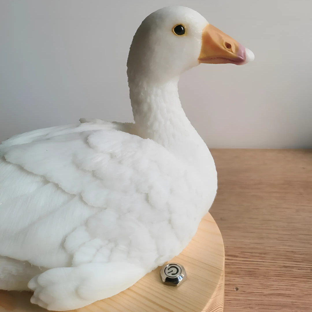 Side profile detail of custom 3D printed white pet Kodak duck statue