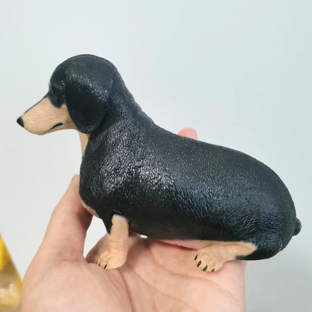 Side profile of custom 3D printed black-yellow pet dachshund dog statue pet loss for friend sympathy gift